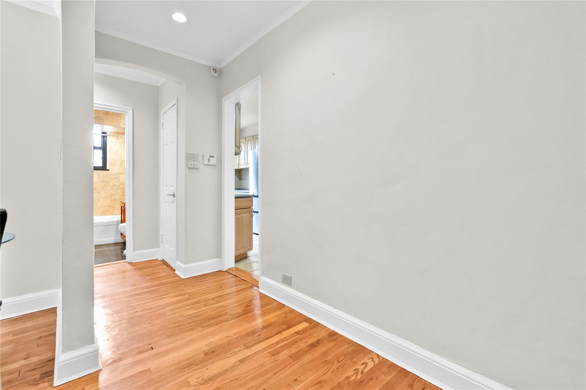 21-40 78th Street, Unit 2 Queens, NY 11370 - Photo 6 of 11 a view of empty room with wooden floor