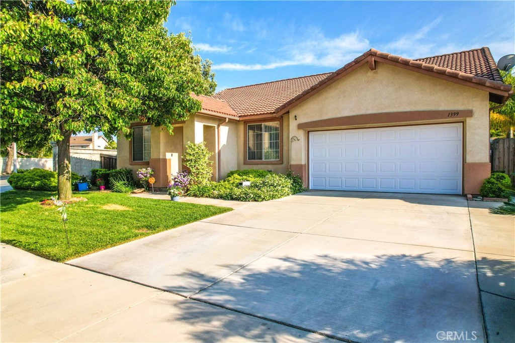 1399 Haddington Drive Riverside, CA 92507 - Photo 1 of 1 a front view of a house with a yard and garage