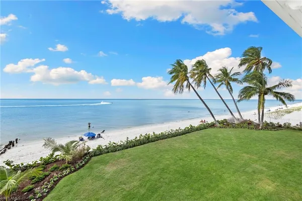 a view of workspace with furniture and a chandelier