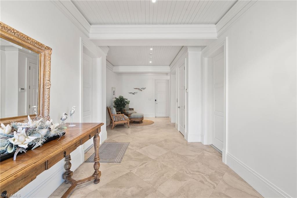 40 32nd Avenue South Naples, FL 34102 - Photo 13 of 49 Hall featuring crown molding and recessed lighting