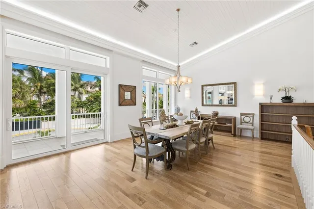 a living room with furniture kitchen view and a fireplace