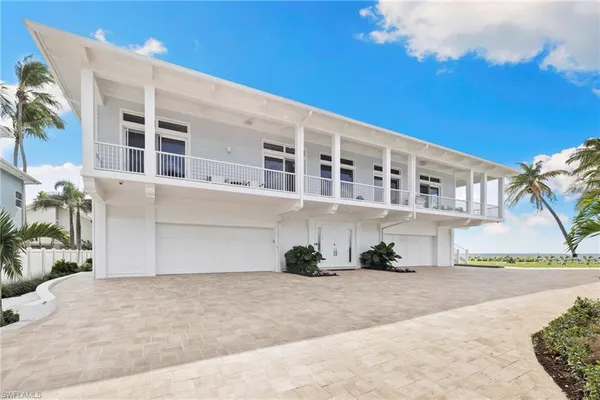 a front view of a building with a yard