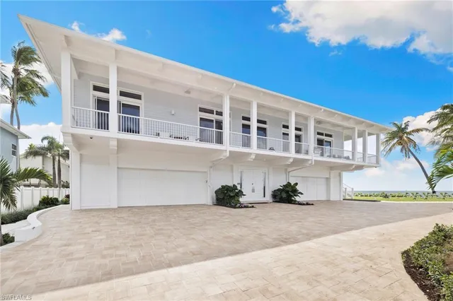 a front view of a building with a yard