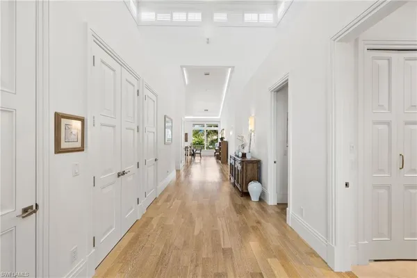 a kitchen with cabinets and flat screen tv
