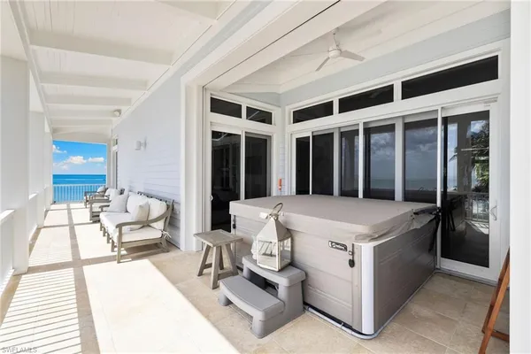 a large white kitchen with a large window