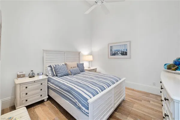 a spacious bedroom with a bed and a couch