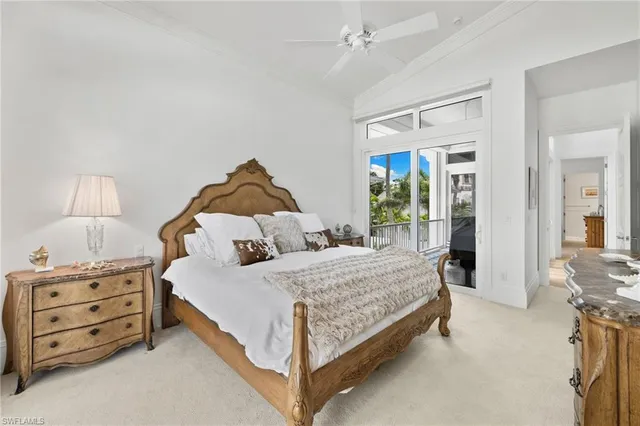 a bedroom with a bed wooden floor and window