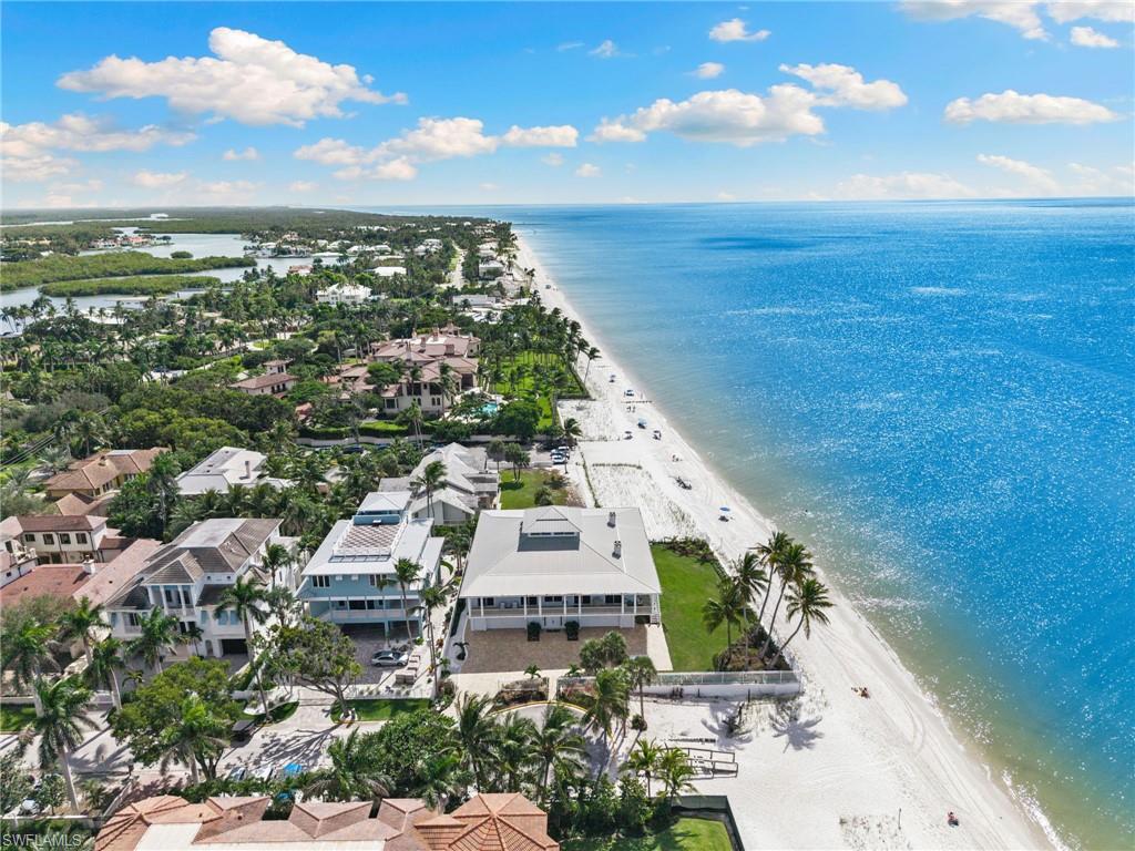 40 32nd Avenue South Naples, FL 34102 - Photo 46 of 49 Drone / aerial view of waterfront with a beach