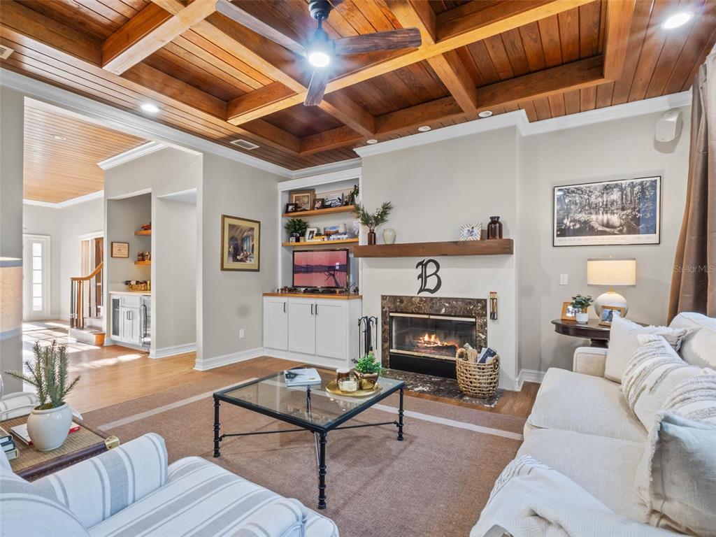 6037 Lake Erie Road Groveland, FL 34736 - Photo 23 of 67 a living room with furniture and a fireplace
