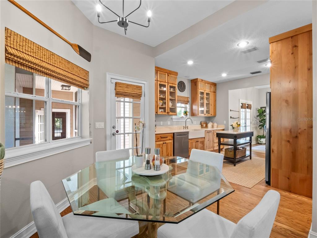 6037 Lake Erie Road Groveland, FL 34736 - Photo 25 of 67 a living room with fireplace furniture and a wooden floor