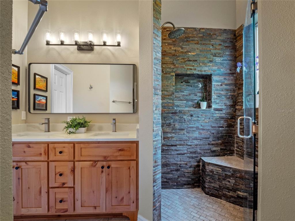 6037 Lake Erie Road Groveland, FL 34736 - Photo 33 of 67 a bathroom with a sink and a mirror