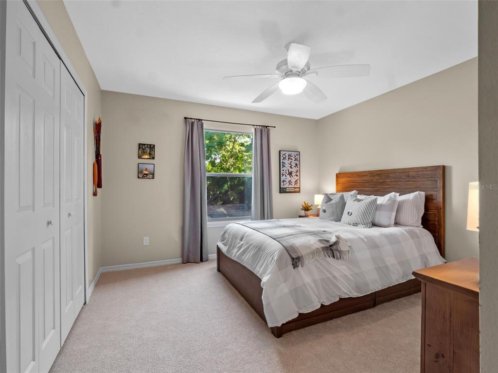 6037 Lake Erie Road Groveland, FL 34736 - Photo 38 of 67 a bedroom with a bed and window