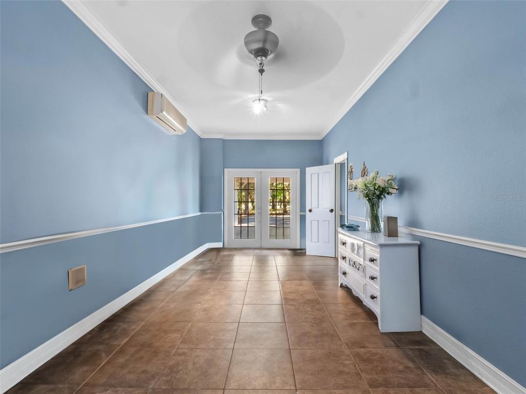 6037 Lake Erie Road Groveland, FL 34736 - Photo 42 of 67 a bedroom with furniture and window