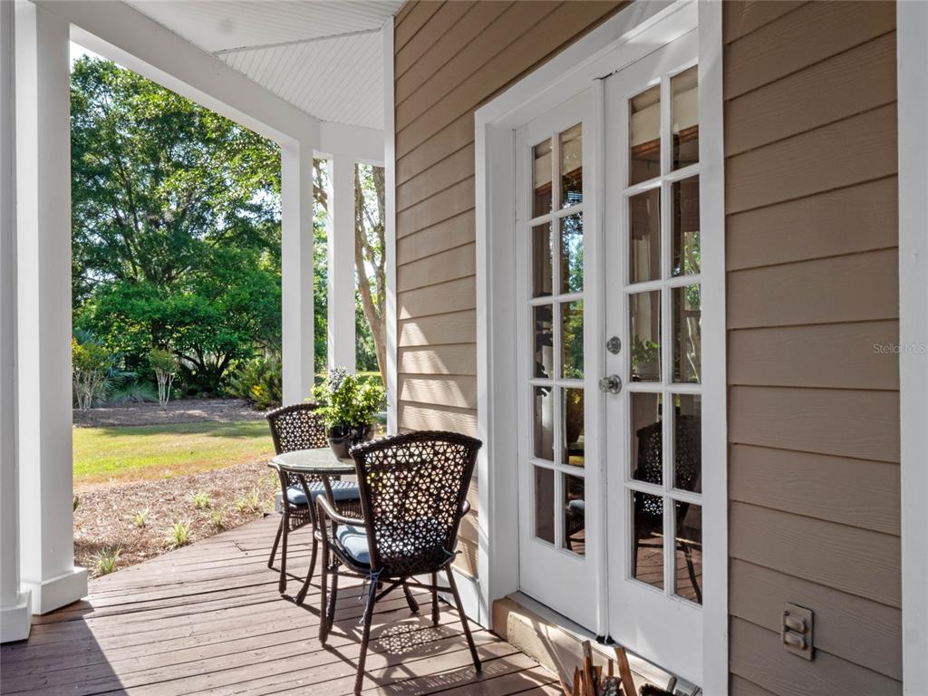 6037 Lake Erie Road Groveland, FL 34736 - Photo 43 of 67 a view of a chair and table in the balcony