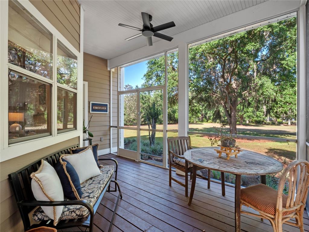6037 Lake Erie Road Groveland, FL 34736 - Photo 44 of 67 a view of a dining room with furniture window and outside view