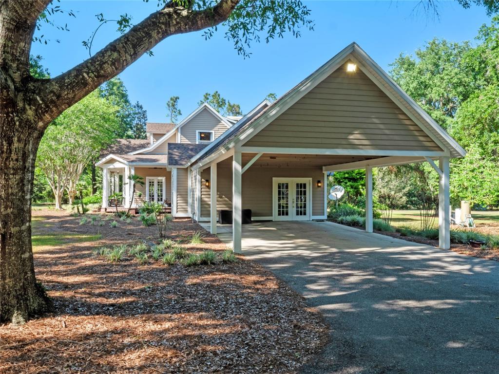 6037 Lake Erie Road Groveland, FL 34736 - Photo 5 of 67 a front view of a house with garden