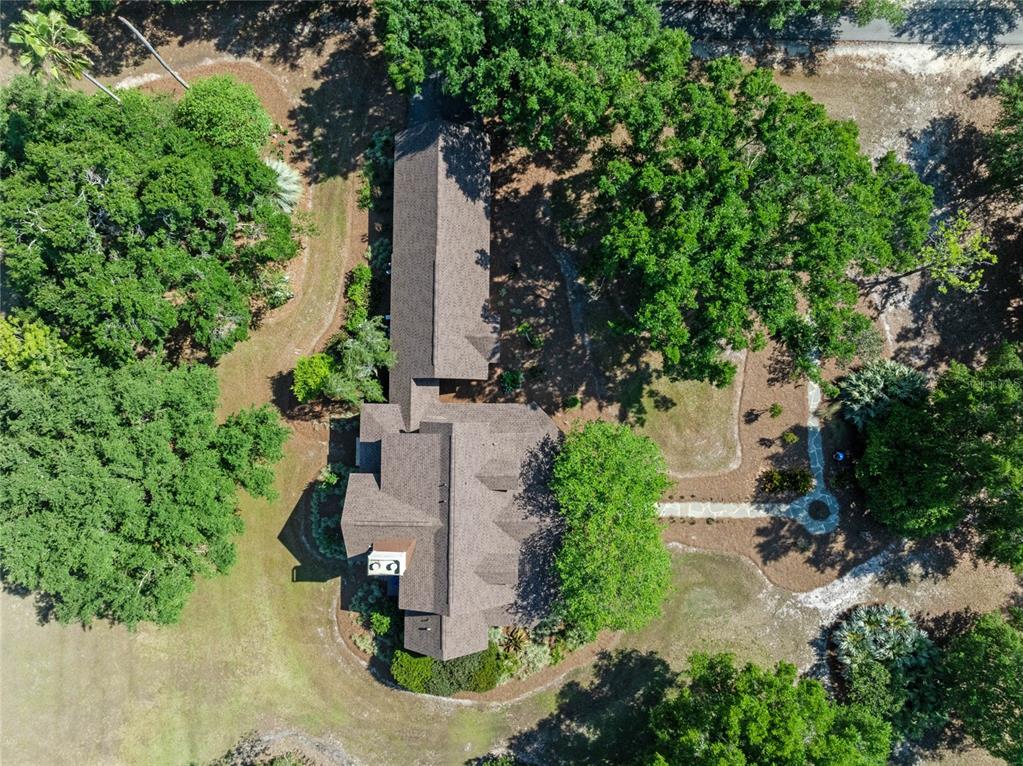 6037 Lake Erie Road Groveland, FL 34736 - Photo 57 of 67 an aerial view of a house with yard and outdoor space