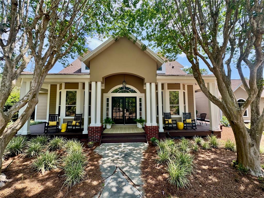 6037 Lake Erie Road Groveland, FL 34736 - Photo 61 of 67 a front view of a house with sitting area