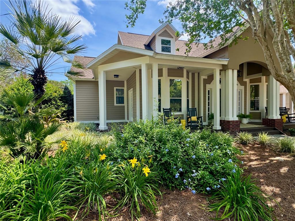 6037 Lake Erie Road Groveland, FL 34736 - Photo 62 of 67 a front view of a house with a yard