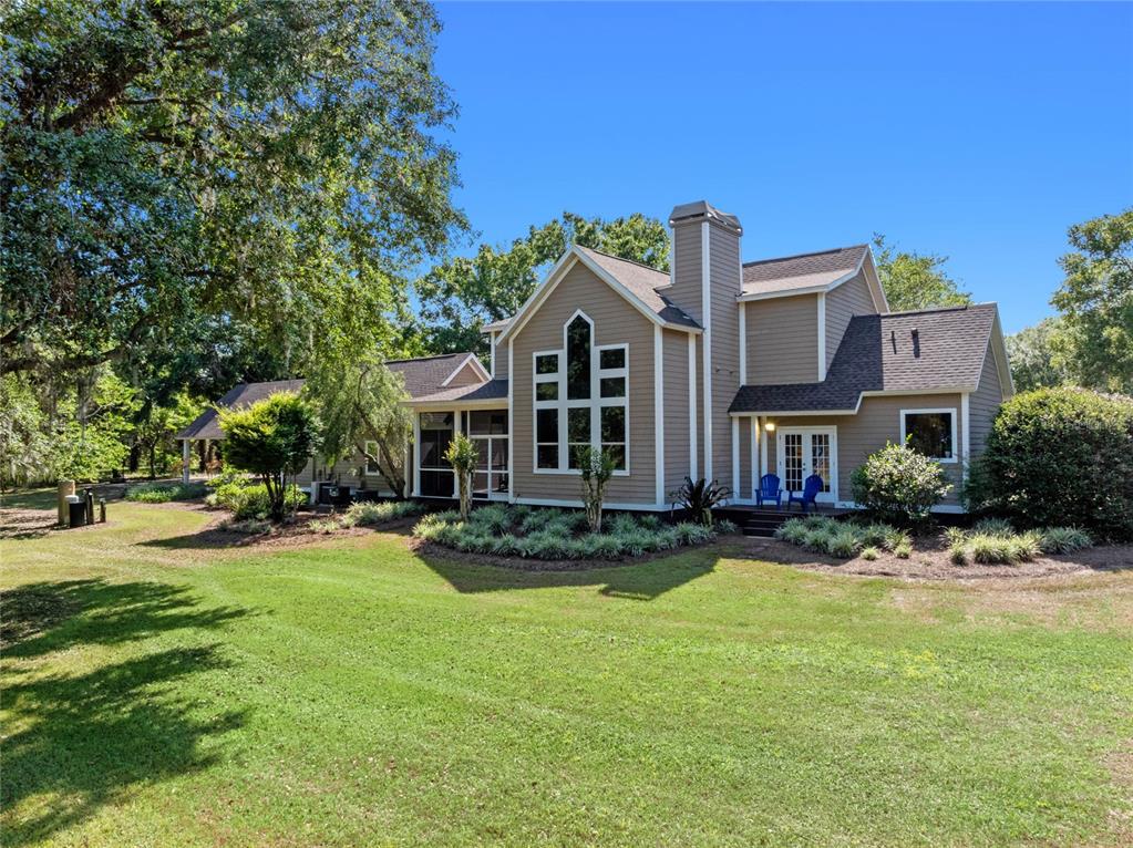 6037 Lake Erie Road Groveland, FL 34736 - Photo 65 of 67 a front view of a house with a yard