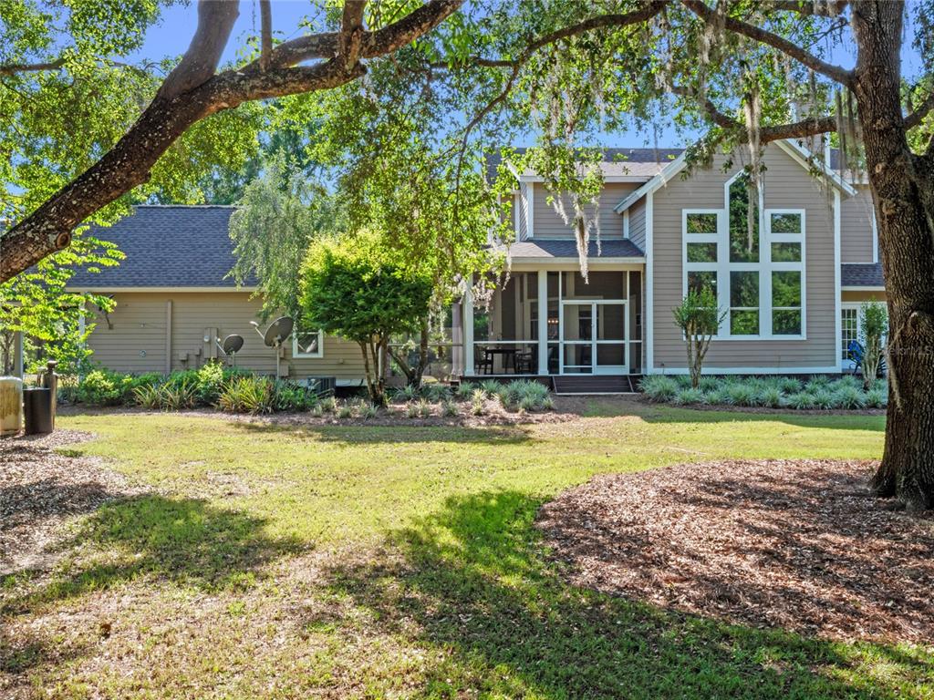 6037 Lake Erie Road Groveland, FL 34736 - Photo 66 of 67 front view of a house with a yard