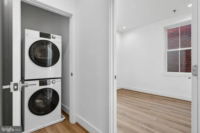 a view of a hallway with washer and dryer