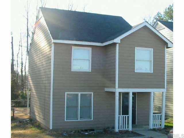 8201 Perry Creek Road Raleigh, NC 27616 - Photo 1 of 1 a brick house with a large windows