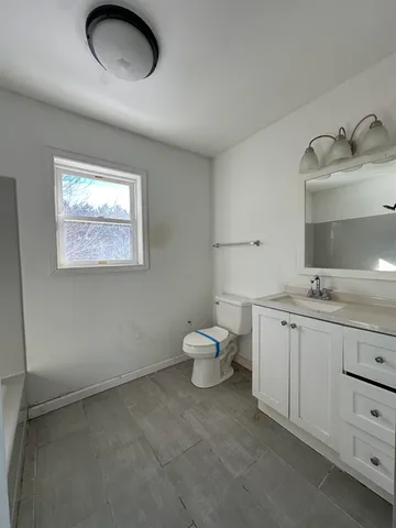 a spacious bathroom with a bathtub and a shower