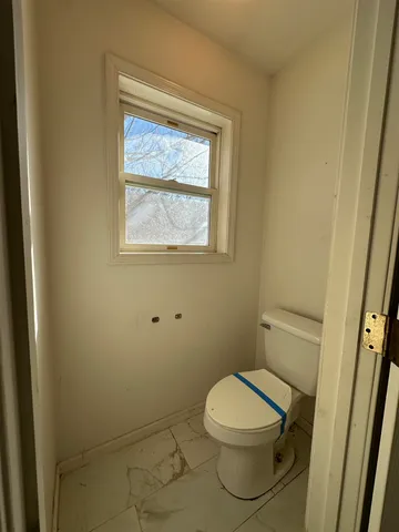 a bathroom with a glass door shower and vanity