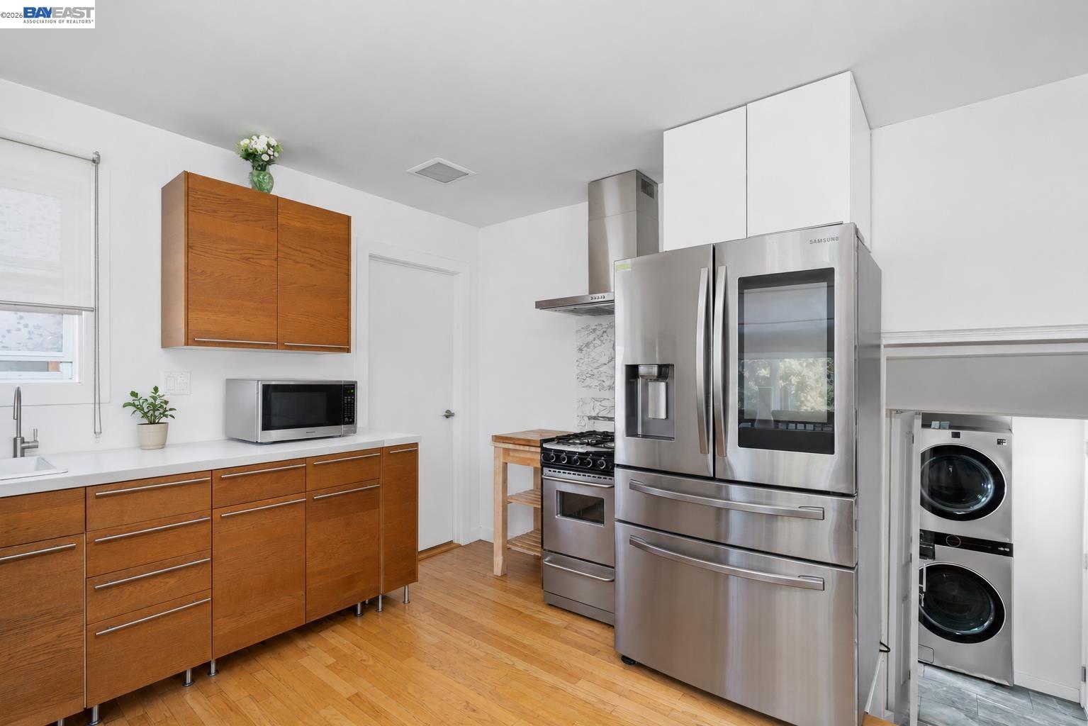 24849 2nd Street Hayward, CA 94541 - Photo 8 of 24 a kitchen with stainless steel appliances granite countertop a refrigerator and a stove top oven