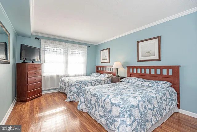 a bedroom with double bed and a window