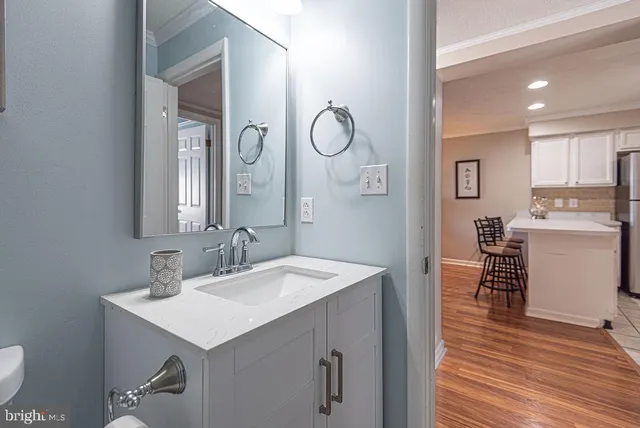 a en suite bathroom with a sink double vanity and a mirror