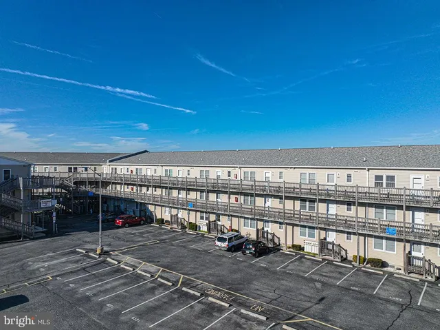 a view of a swimming pool with outdoor seating