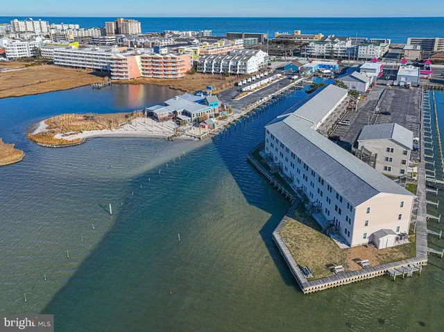 an aerial view of a house with a ocean view