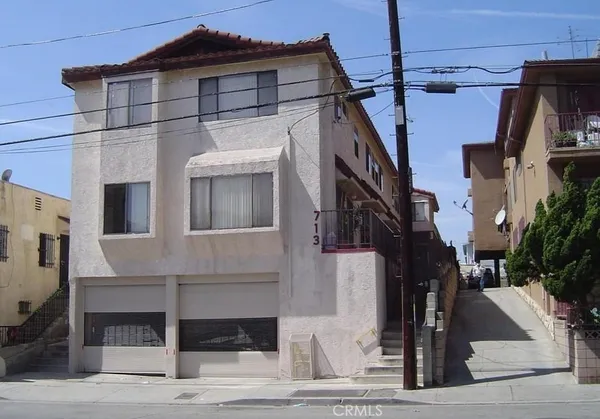 a front view of a house with a garage