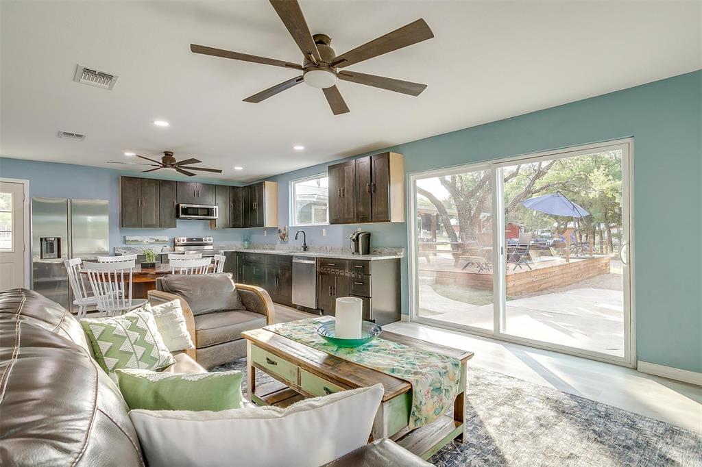 520 Deer Trail Gordon, TX 76453 - Photo 22 of 40 Living room featuring plenty of natural light, ceiling fan, and recessed lighting