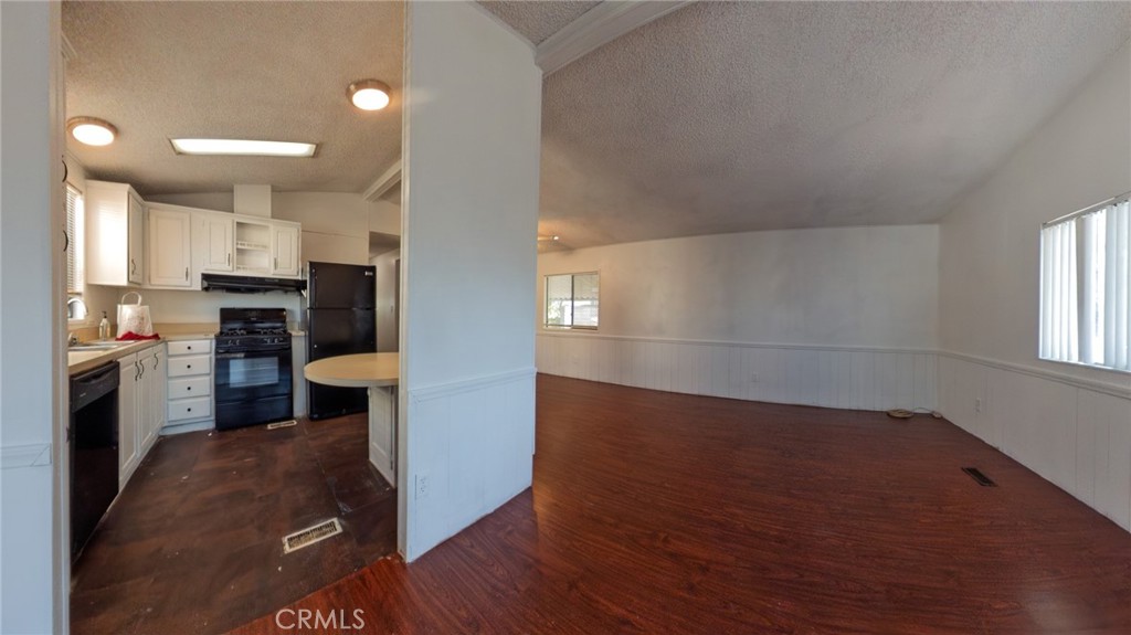 432 South Harbor Boulevard, Unit 7 Santa Ana, CA 92704 - Photo 12 of 35 a kitchen with a refrigerator and a stove top oven