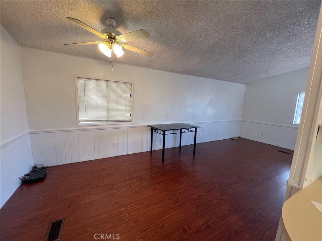432 South Harbor Boulevard, Unit 7 Santa Ana, CA 92704 - Photo 13 of 35 a view of an empty room with wooden floor and a window