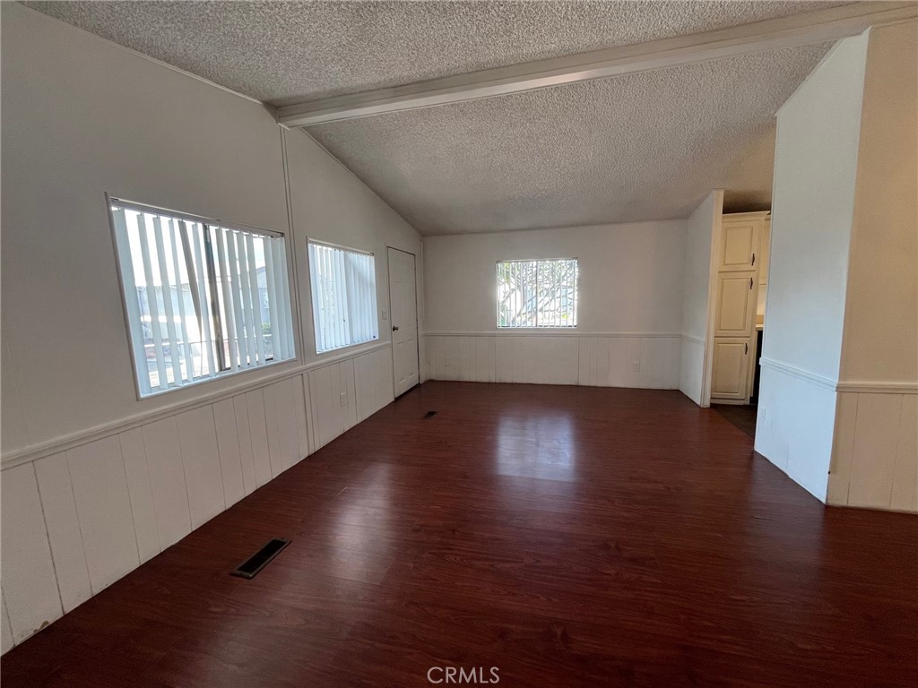 432 South Harbor Boulevard, Unit 7 Santa Ana, CA 92704 - Photo 14 of 35 a view of an empty room with wooden floor and a window