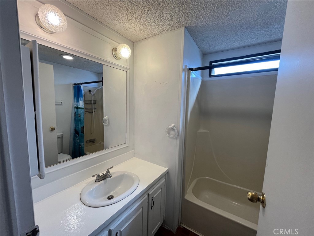 432 South Harbor Boulevard, Unit 7 Santa Ana, CA 92704 - Photo 19 of 35 a bathroom with a sink shower and a mirror