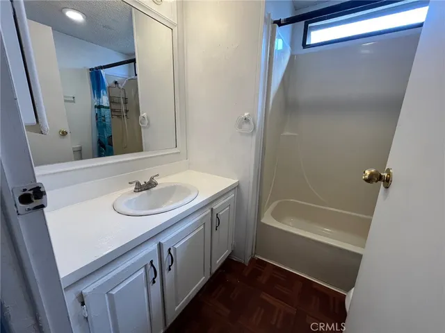 a bathroom with a glass shower door