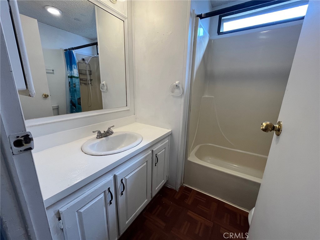 432 South Harbor Boulevard, Unit 7 Santa Ana, CA 92704 - Photo 20 of 35 a bathroom with a sink a mirror and a bathtub