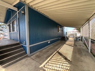 432 South Harbor Boulevard, Unit 7 Santa Ana, CA 92704 - Photo 2 of 35 a view of a porch with wooden floor and stairs