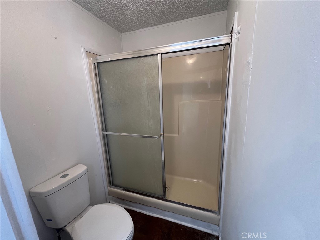 432 South Harbor Boulevard, Unit 7 Santa Ana, CA 92704 - Photo 25 of 35 a bathroom with a glass shower door