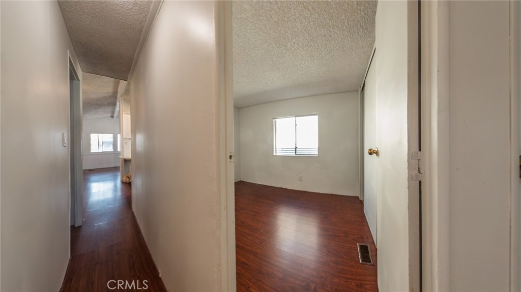 432 South Harbor Boulevard, Unit 7 Santa Ana, CA 92704 - Photo 27 of 35 a view of a hallway with wooden floor