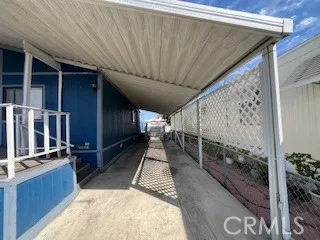 a kitchen with stainless steel appliances a refrigerator a sink a stove a table and chairs