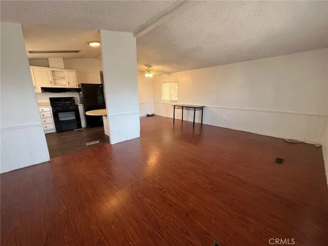 a kitchen with a sink a stove and refrigerator