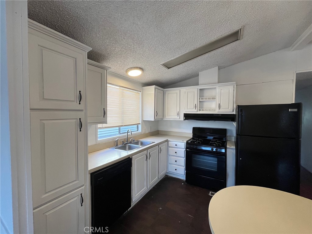 432 South Harbor Boulevard, Unit 7 Santa Ana, CA 92704 - Photo 10 of 35 a kitchen with a sink a stove and refrigerator