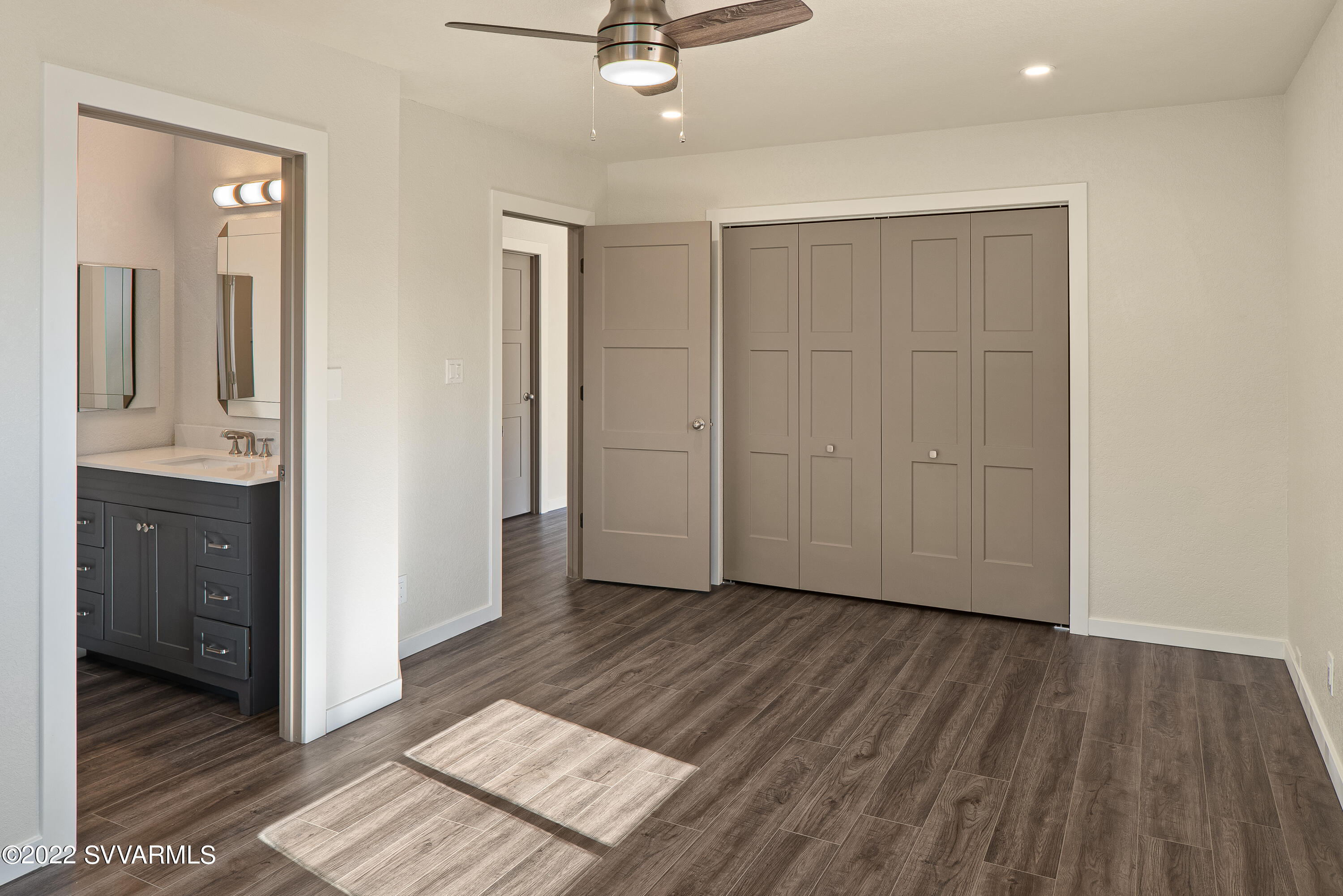 2380 Buckboard Road Sedona, AZ 86336 - Photo 15 of 25 wooden floor in an empty room with a window