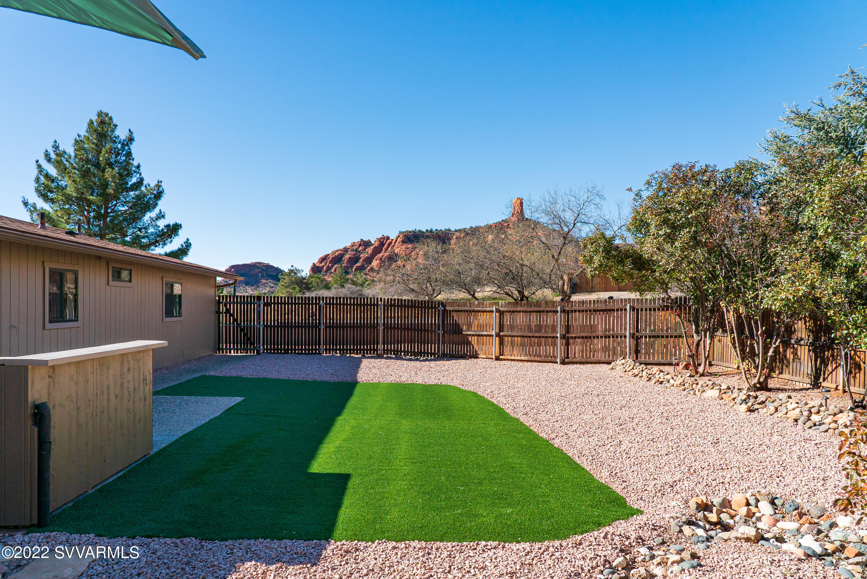 2380 Buckboard Road Sedona, AZ 86336 - Photo 24 of 25 a view of a backyard with a small cabin
